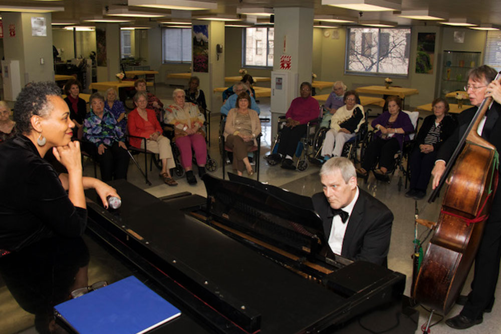 Classical musicians performing for long term residents.